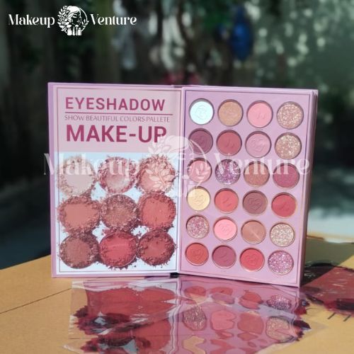 Mocallure 5 Step Make-up eyeshadow palette with colorful shades on a reflective surface, blurred greenery in the background.